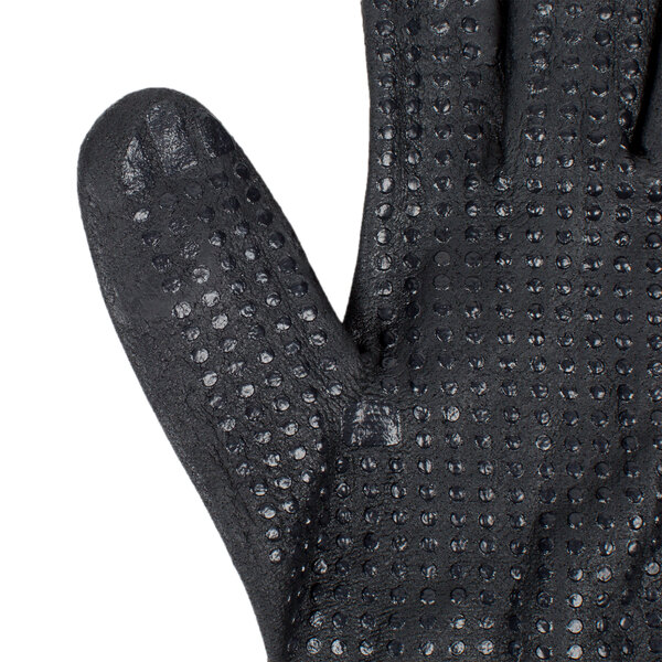 A close up of a black Cordova warehouse glove with black foam nitrile and nitrile dots on the palm.
