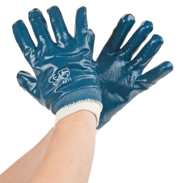A pair of blue Cordova gloves with white palms.