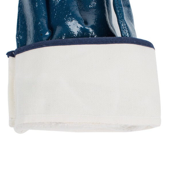A blue Cordova nitrile glove with a white fabric cuff.