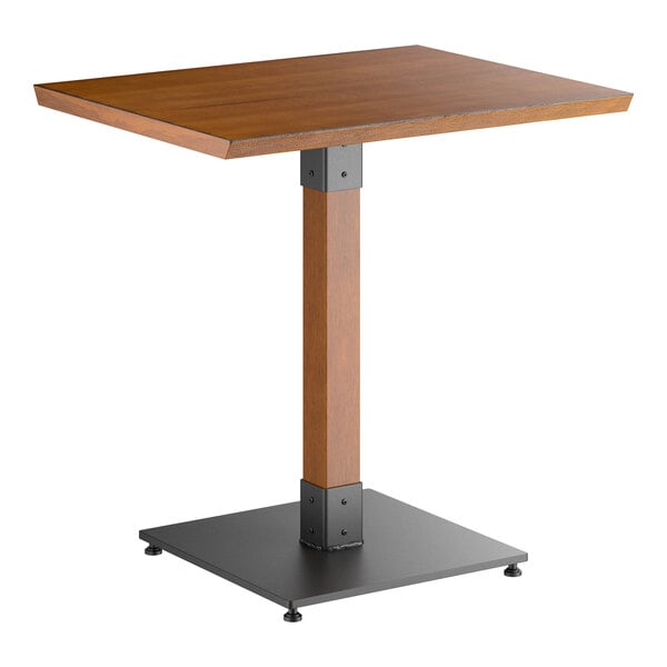 A rectangular table with a wooden top, a single wooden central support, and a black square metal base.