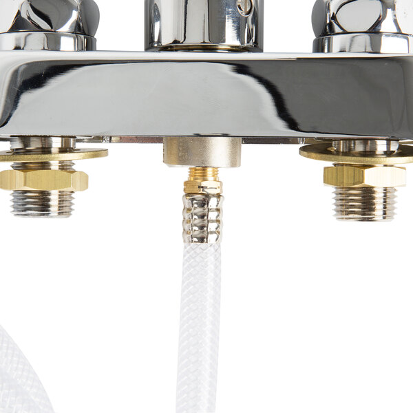 A close up of a chrome T&S deck mounted faucet with a silver self-closing spray nozzle.