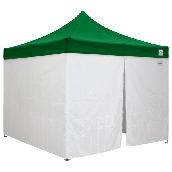 A green tent top with white walls on a white surface.