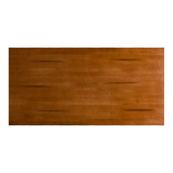 A rectangular solid wood table top with a rustic walnut finish and live edge design.