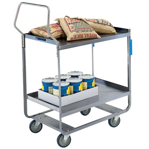 A Lakeside stainless steel two shelf utility cart with bags of food and blue cans on it.