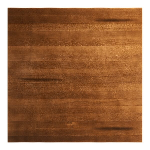 A rectangular solid wood table top with a rustic walnut finish and visible wood grain.