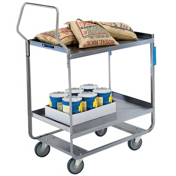 A Lakeside stainless steel utility cart with bags of food and cans on it.