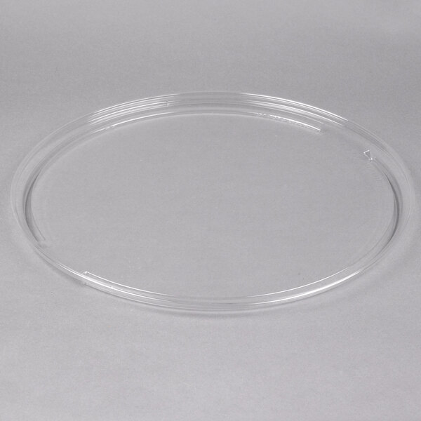 A clear plastic circle lid on a white background.