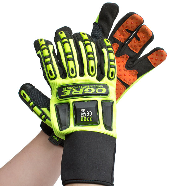 A pair of lime green and black Cordova heavy duty work gloves with orange and black accents on a white background.