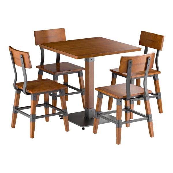 A square wooden table with a rustic walnut finish is paired with four matching chairs featuring metal accents and wooden seats and backs.