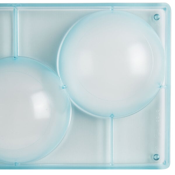 A clear plastic container with circles.