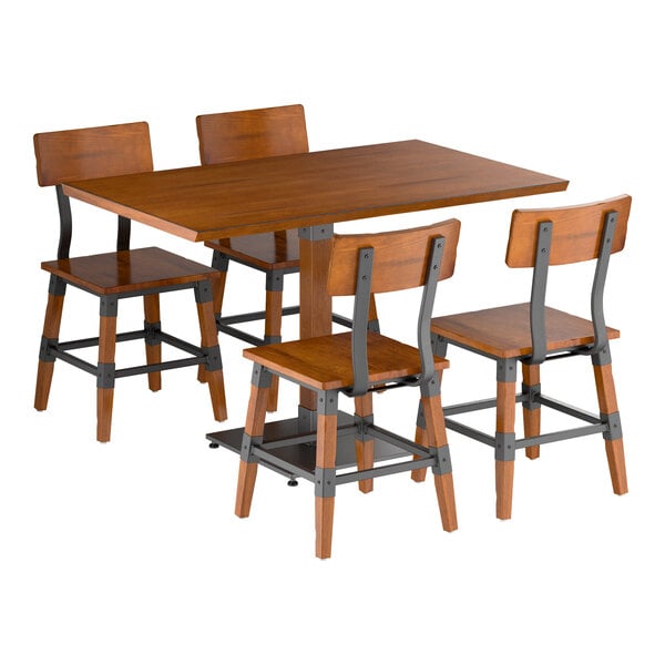 A rectangular wooden dining table with a rustic finish, accompanied by four matching chairs featuring metal accents.