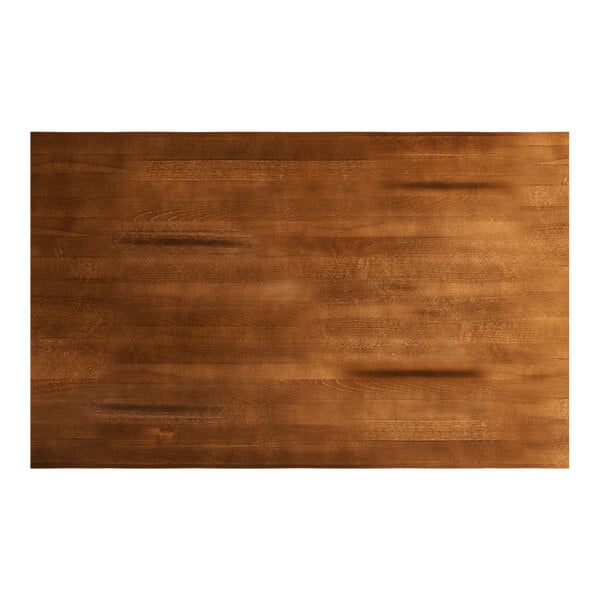 A rectangular solid wood bar height table top with a rustic walnut finish.