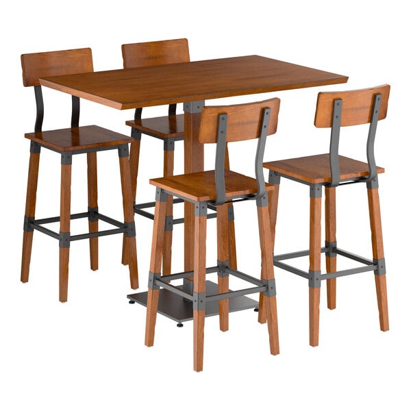 A wooden bar-height table with a rectangular top and four matching bar stools, all featuring metal supports and a rustic finish.