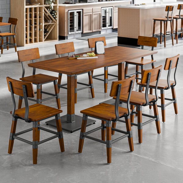 A Lancaster Table & Seating rustic wood table with chairs in a dining area.