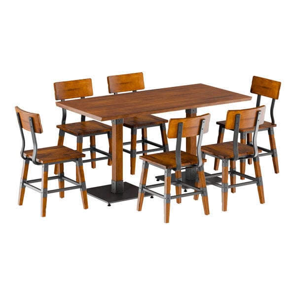 A Lancaster Table & Seating rustic walnut live edge table with metal legs and six chairs.