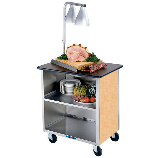 A Lakeside stainless steel utility cart with food on it.