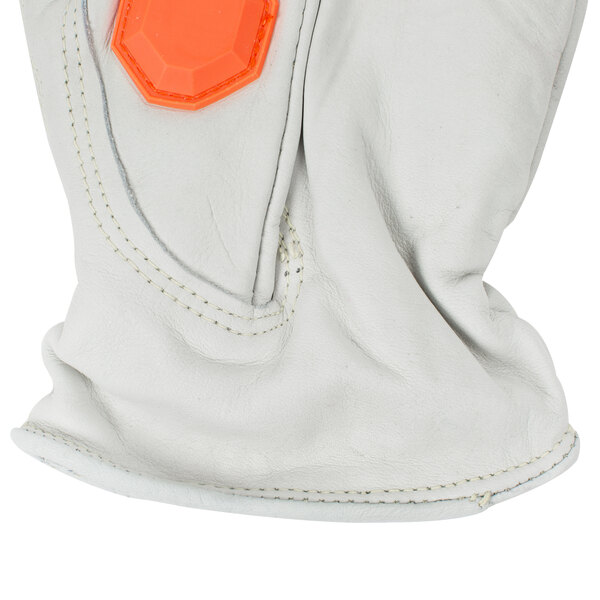 A close up of a Cordova Outlaw Impact leather driver's glove with orange TPR protectors.