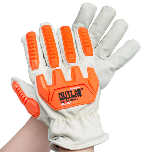 A close up of a hand wearing a Cordova Outlaw leather glove with orange and white accents.