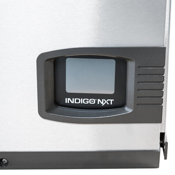 A white Manitowoc Indigo NXT water cooled ice machine.