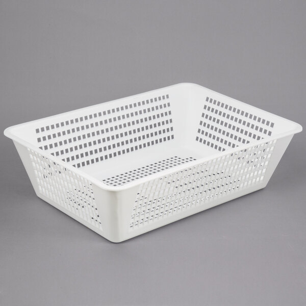 A white plastic perforated drain box.