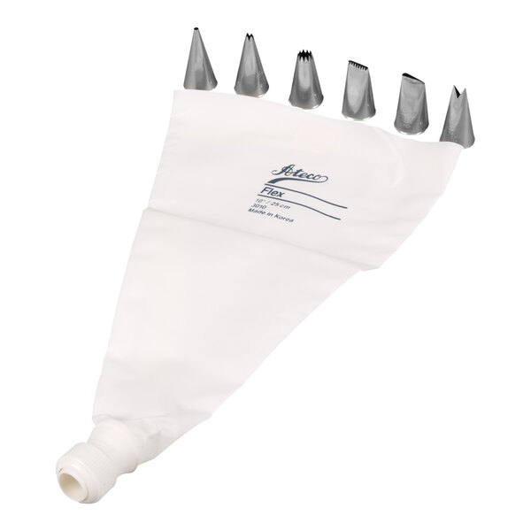 A white piping bag with eight different stainless steel decorating tips arranged above it.