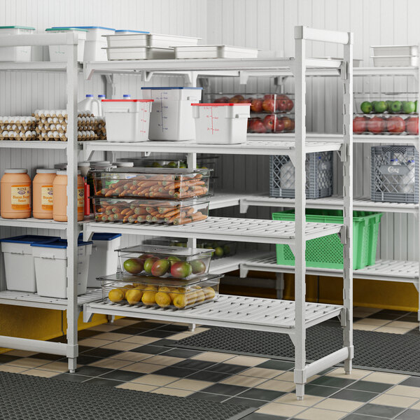 A white Cambro Camshelving® Premium add on unit with four vented shelves holding food.