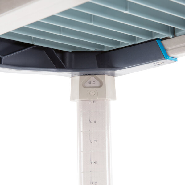 A MetroMax polymer shelving unit with white and blue plastic components.