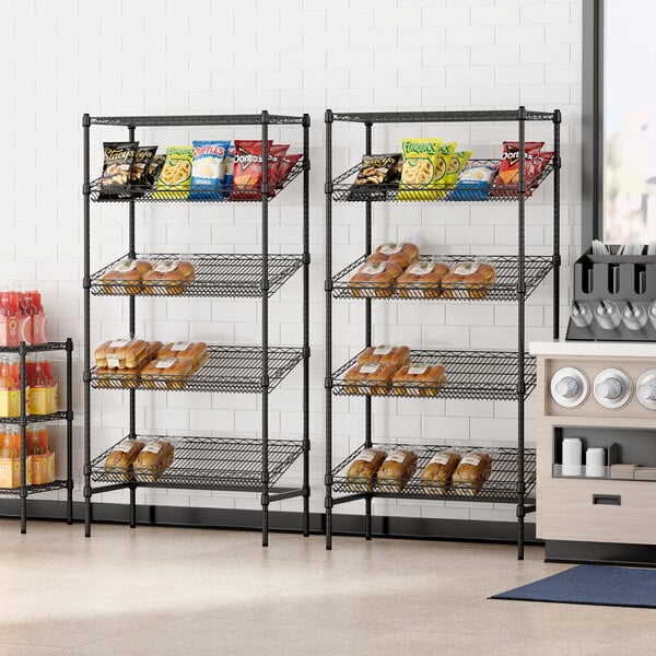 A Regency black wire rack with food and pastries on it.