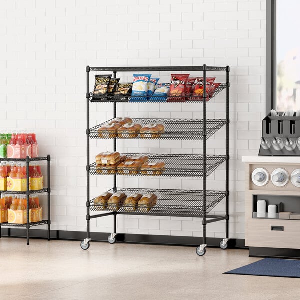 A Regency black wire shelving rack with food on a shelf.