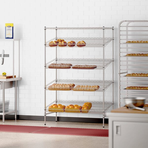 A Regency stationary wire rack with bread on it in a bakery.