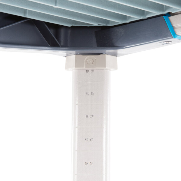 A MetroMax i shelving kit with blue and white polymer shelves and poles.