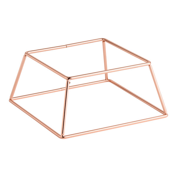 A square rose gold metal display stand with an open geometric frame design.