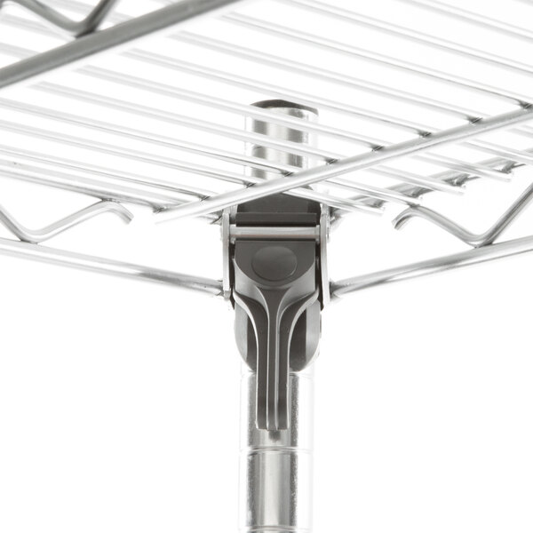 A close-up of a Metro Super Erecta wire shelf with metal hooks.
