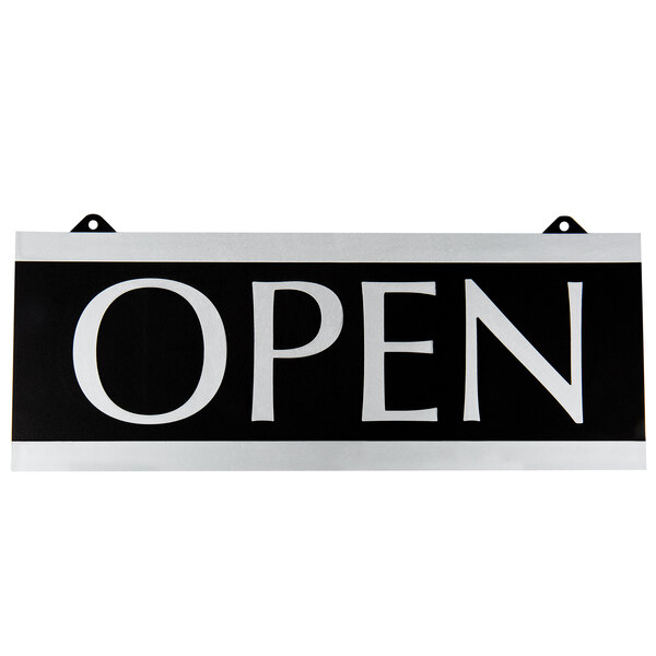 A black and white Headline Sign with white text that says "Open" and "Closed"