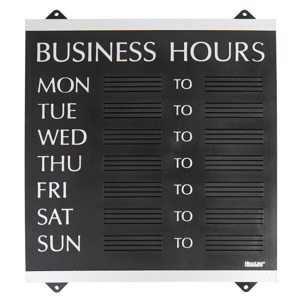 A black Headline Sign business hours sign with white text on a white background.