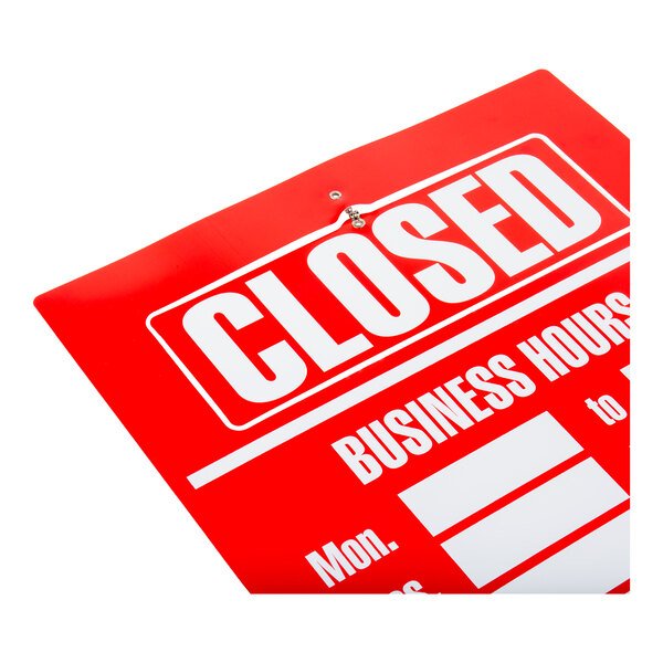 A partial view of a red sign with the word 'CLOSED' in large white letters and spaces for business hours.