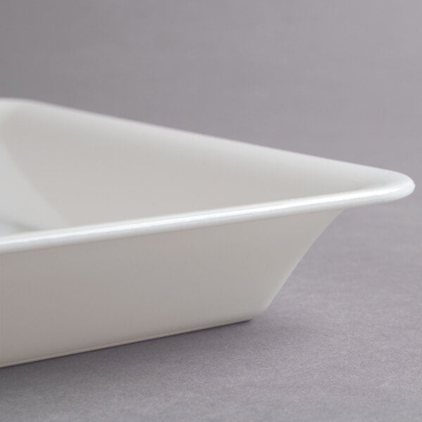 A white Fineline rectangular plastic catering tray with a lid.