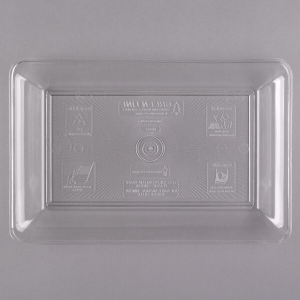 A clear plastic Fineline rectangular catering tray with a label on it.