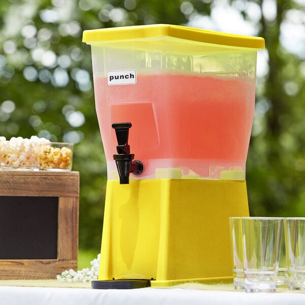 A yellow Choice slim beverage dispenser with a black spigot and glasses.