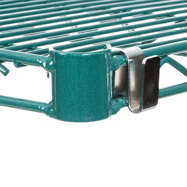 A close-up of a green Metro Super Erecta wire shelf.