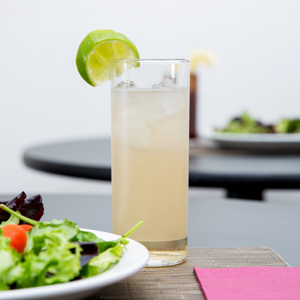 a plate of salad and a glass of juice
