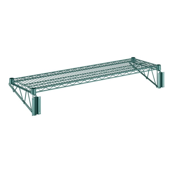 A Regency green metal wire wall mount shelf with two metal supports.