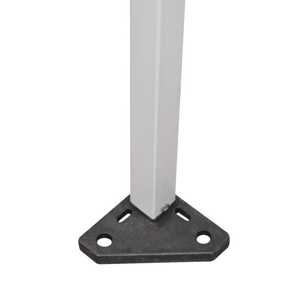 A white metal pole with a black base.