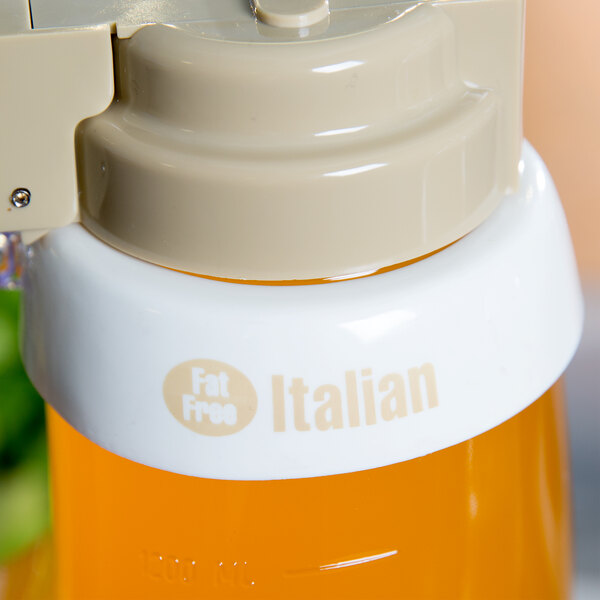 A Tablecraft white plastic salad dressing dispenser collar with beige lettering.