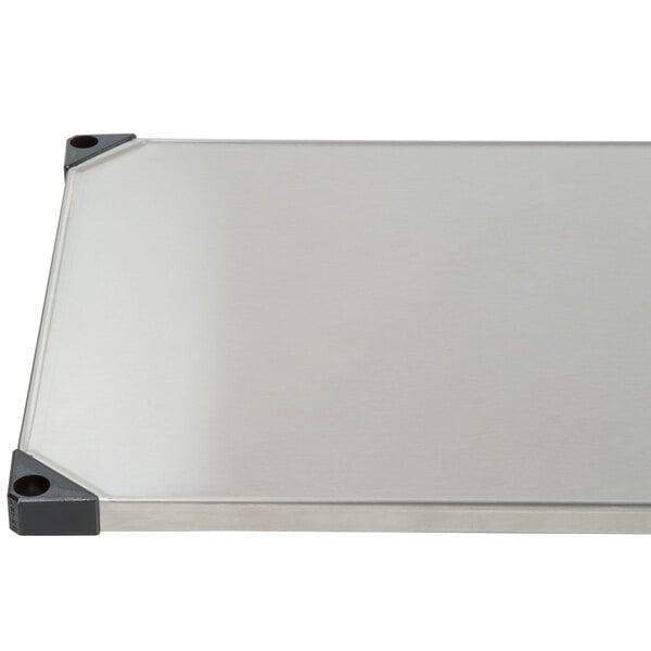 A Metro stainless steel shelf with black trim.