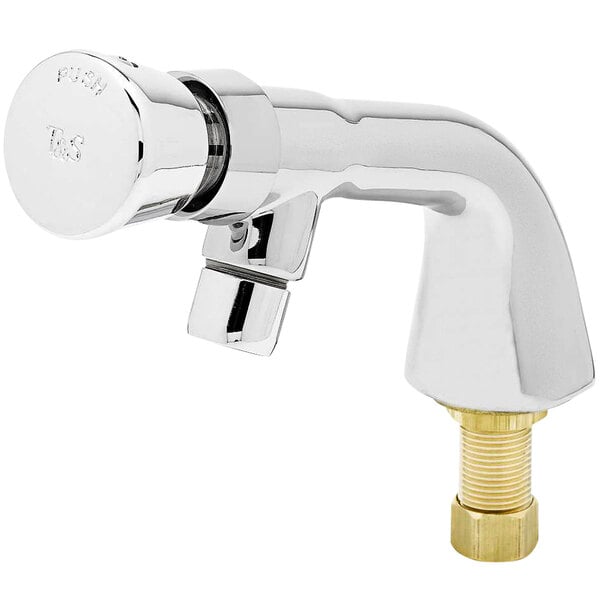 A close up of a chrome T&S metering faucet with a gold nut.
