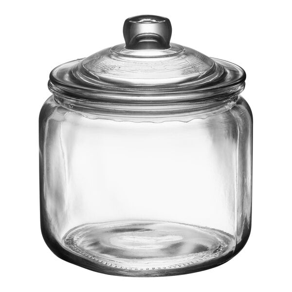 A clear glass jar with a matching glass lid.