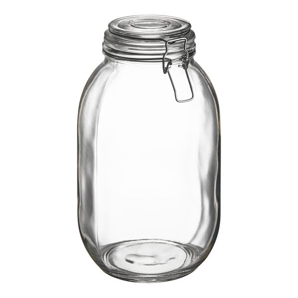 A large clear glass storage jar with a hinge top lid and metal clasp.