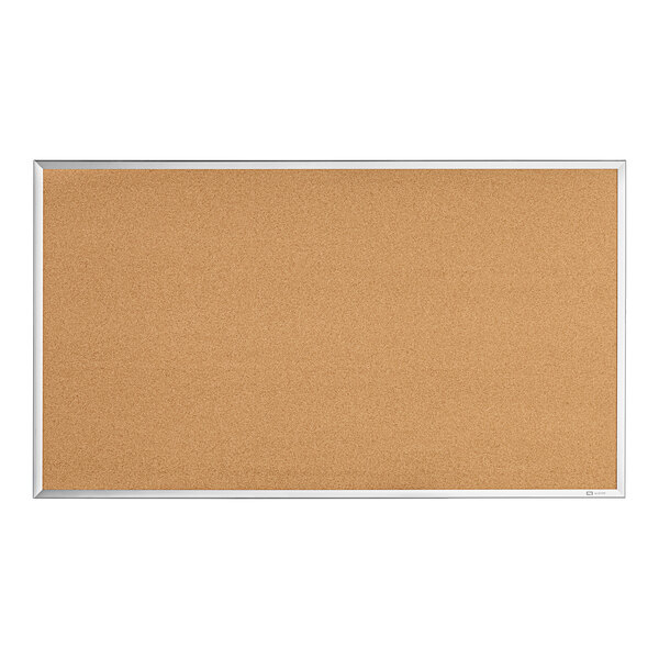 A Quartet cork board with a silver aluminum frame.