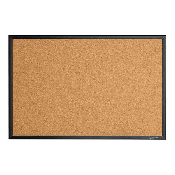 A Quartet cork board with a black aluminum frame.